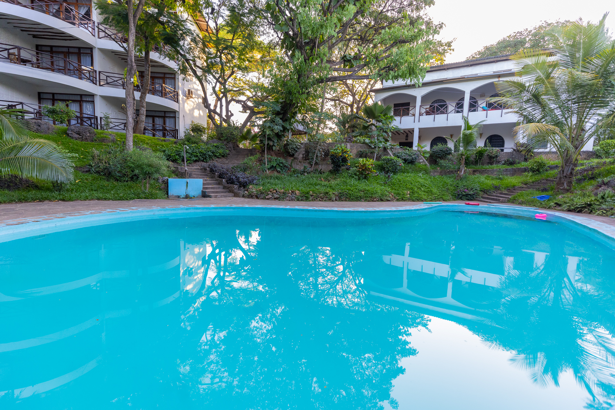 Tropical swimming pool surrounded by gardens at Silver Rock Boutique Resort